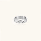 Braided stainless steel band ring with geometric interwoven strands in brushed silver finish on white background